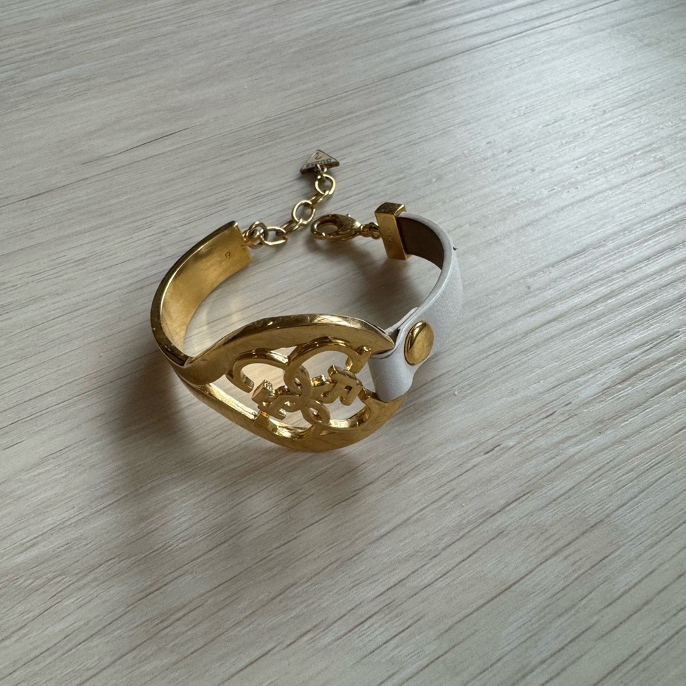Guess gold plated white leather bracelet-bangle.
